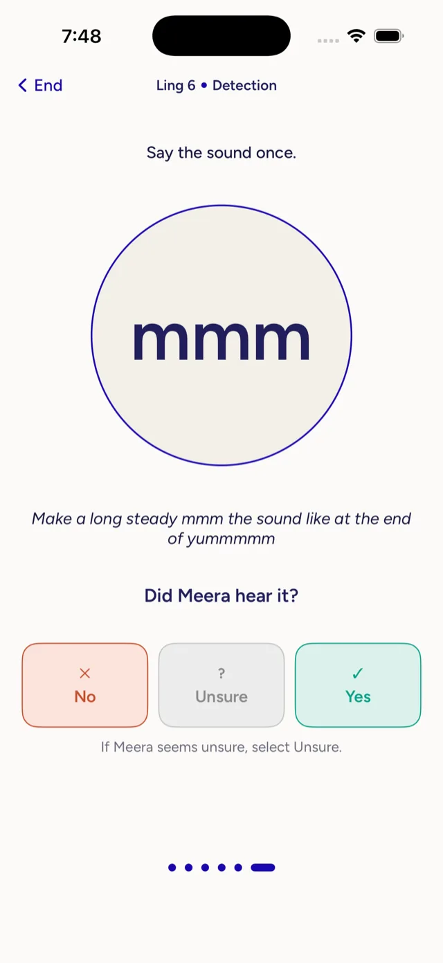 A live check prompting the parent to say a long steady "mmm" and mark whether the child heard it.